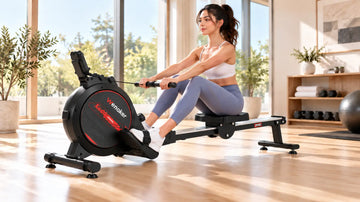 Petite female athlete demonstrating optimal catch position on the Wenoker R10 rowing machine with vertical shins and a flat, braced back.