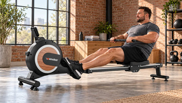 A powerful adult rower executing a smooth, confident leg drive on the Wenoker R20 Pro magnetic rowing machine in an airy modern home gym.