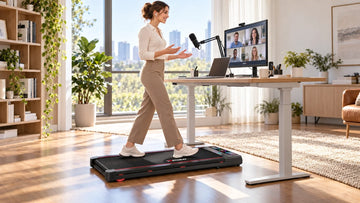 A remote professional walking comfortably on a sleek black Wenoker T10 under desk treadmill while speaking on a Zoom video conference in a modern home office.