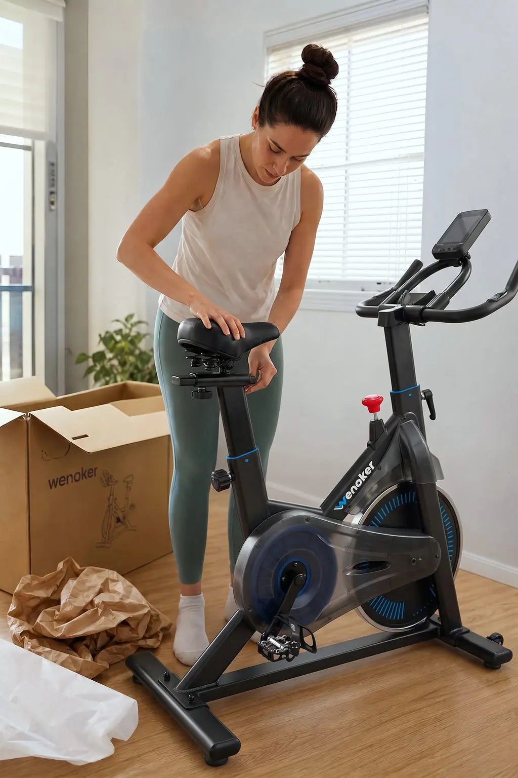 A woman assembling and adjusting the seat of a Wenoker stationary exercise bike after unboxing in a bright home living room.